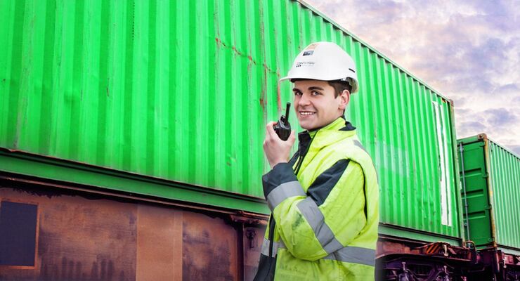 Portrait,Of,Shipping,Worker,Checking,Cargo,Containers,At,Train,Station